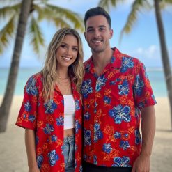 Close-up view of red and blue Hawaiian shirt showing detailed hibiscus flower pattern with white highlights
