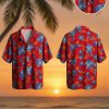 Red and blue Hawaiian shirt featuring large blue hibiscus flowers with white accents and red floral clusters on vibrant red background