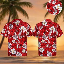 Red and white Hawaiian shirt with large white hibiscus flowers and tribal patterns worn in lifestyle setting
