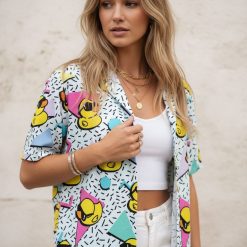 Rubber ducky hawaiian shirt showing cartoon ducks with sunglasses among colorful triangles and circles