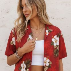 Ryan Reynolds Red Notice Hawaiian shirt displaying white hibiscus with yellow centers and green tropical leaf design