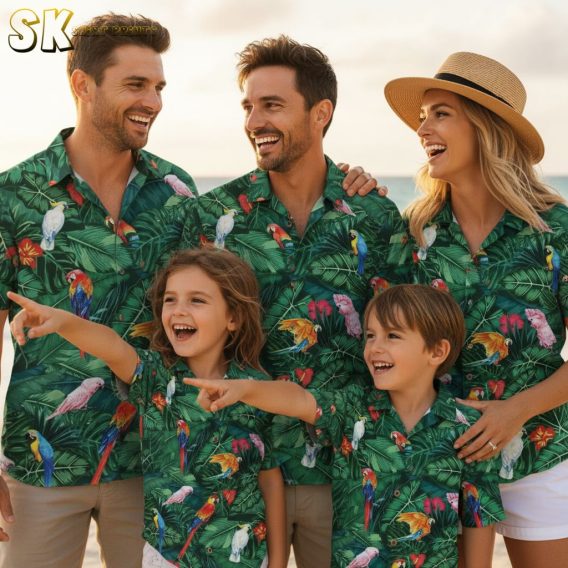 Sage green Hawaiian shirt displaying colorful parrot motifs with red flower accents