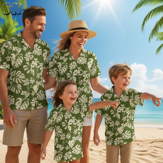 Sage green Hawaiian shirt showing large leaf motifs and small flower details in cream color