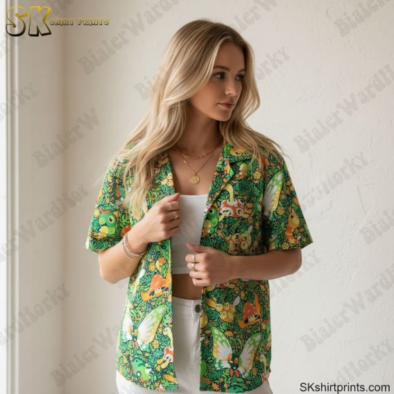 Sage green Hawaiian shirt with colorful nature motifs including butterflies and mushrooms in tropical arrangement