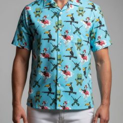 Tactical Hawaiian shirt displaying toucans with guns and flamingo graphics in tropical print design