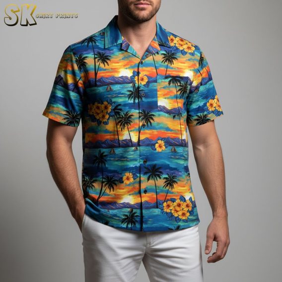Tropical Hawaiian shirt displaying sunset sailboat scene with hibiscus flowers and beach elements