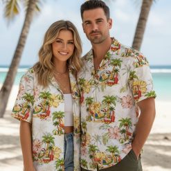 Tropical santa shirt with Hawaiian beach print showing palm trees, surfboards, hibiscus flowers, and tropical beach scene