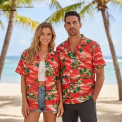 Close-up view of vintage red Hawaiian shirt showing sailboat and beach umbrella pattern details