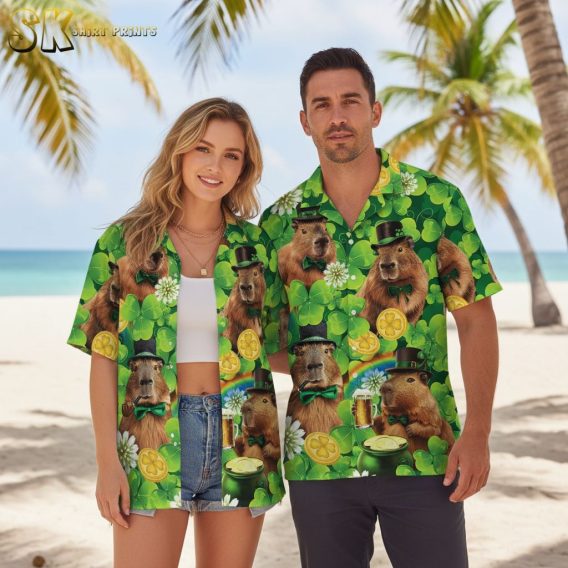 White and green Hawaiian shirt displaying white flowers and green shamrocks with capybara artwork