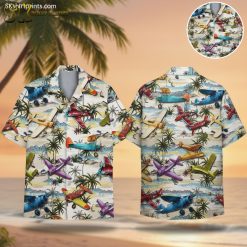 White mens Hawaiian shirt featuring colorful vintage airplanes flying over tropical palm trees and ocean scenery