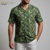 Womens green hawaiian shirt displaying rainforest leaf pattern with intricate botanical details