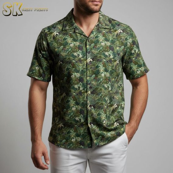 Womens green hawaiian shirt displaying rainforest leaf pattern with intricate botanical details