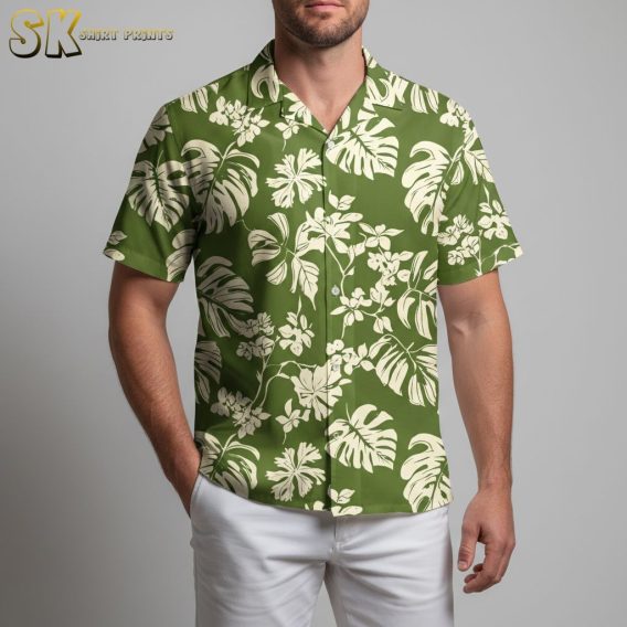 Women's green Hawaiian shirt with large tropical leaf patterns and small flowers in off-white