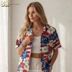 Women's red Hawaiian shirt displaying bold tropical flowers in red, white and blue colors