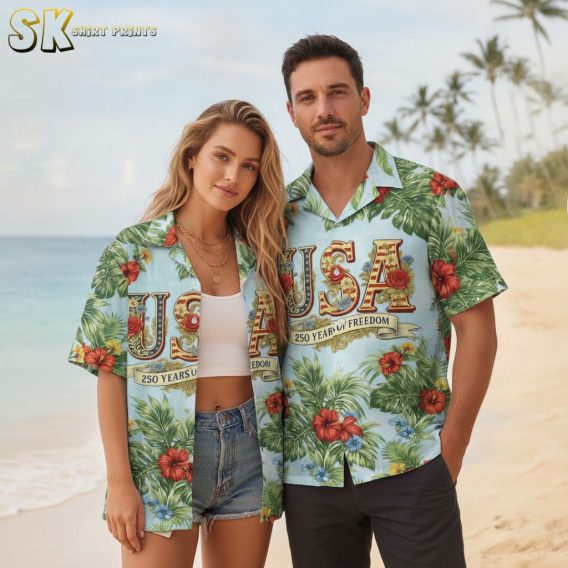 250th anniversary Hawaiian shirt with large tropical flowers in red yellow and blue, green leaf pattern, centered USA text in red and gold, and 250 Years of Freedom text on light blue fabric