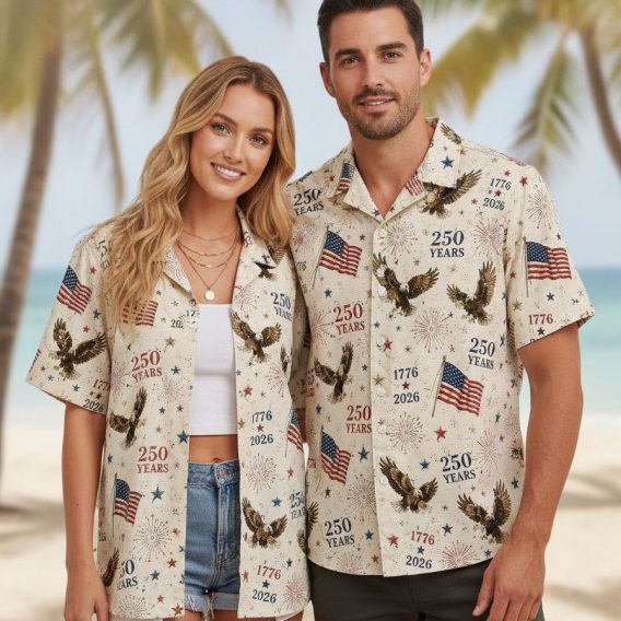America 250 Hawaiian shirt with all-over print of bald eagles, American flags, fireworks, stars, and the years 1776 and 2026 in red, white, and blue.