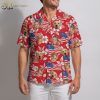 America 250 Hawaiian shirt in red with all-over print of portrait faces, a dog wearing sunglasses, American flags, and white hibiscus flowers