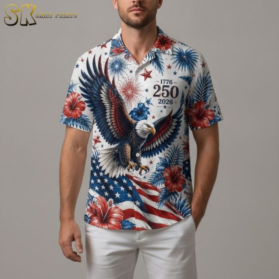 America 250 Hawaiian shirt with red and blue hibiscus flowers, bald eagle, fireworks, and stars and stripes pattern across the fabric