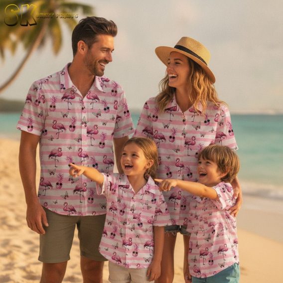 Blue hawaiian shirt with pink flowers featuring flamingo, pineapple, and butterfly tropical design elements