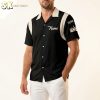 Male model wearing a custom bowling shirt for men with bowling ball and pin graphic on the back and name field on the front, studio white background