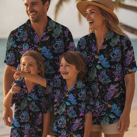 Custom designed Hawaiian shirt with hand-illustrated raccoon astronauts floating in space among neon planets, stars, and rockets printed across the fabric