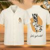 Hawaiian shirt with sketched giraffe print on an orange background and Let's Get Wild text on the pocket