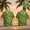 Green and white Hawaiian shirt featuring cartoon turtles, bees, and tropical flowers on dark green background