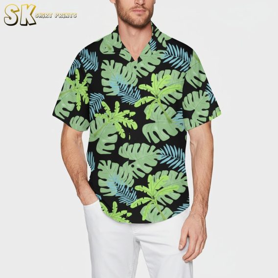 Green Hawaiian shirt with tropical monstera and palm leaf pattern on dark background