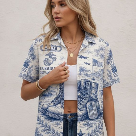 Marine Hawaiian shirt with monochromatic USMC print showing boots, dog tags, American flag, palm trees, and a large back graphic of a Marine in combat gear with 1776-2026 anniversary text