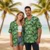 Men's green Hawaiian shirt displaying tropical leaf pattern with varied leaf shapes and sizes