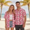 Mens pink Hawaiian shirt with pink hibiscus flowers, white accents, and dark green leaf pattern