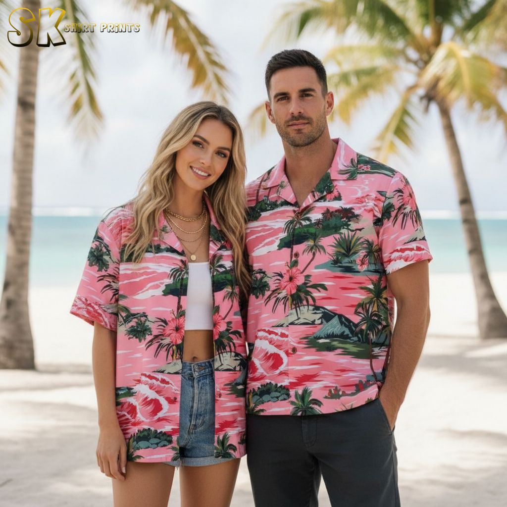 Pink and black Hawaiian shirt displaying tropical palm trees, waves, and hibiscus flowers in contrasting color design