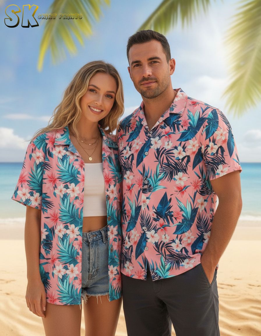 Pink and white Hawaiian shirt displaying white floral blooms with pink accents and blue tropical foliage