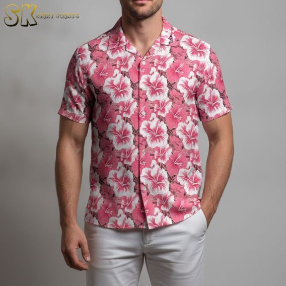 Pink Hawaiian shirt displaying tropical hibiscus flowers with white details and green foliage