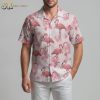 Pink pineapple Hawaiian shirt with flamingo and tropical flower pattern on light colored fabric