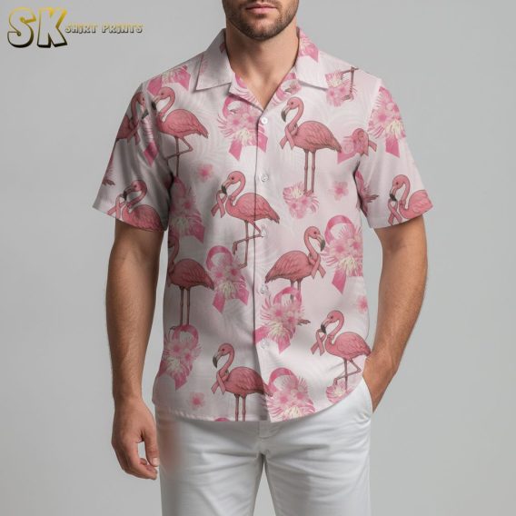 Pink pineapple Hawaiian shirt with flamingo and tropical flower pattern on light colored fabric