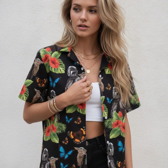 Star Wars R2D2 Hawaiian shirt showing helmeted characters, small creature with large ears, red hibiscus blooms, green leaves, and blue and orange butterflies in an all-over print