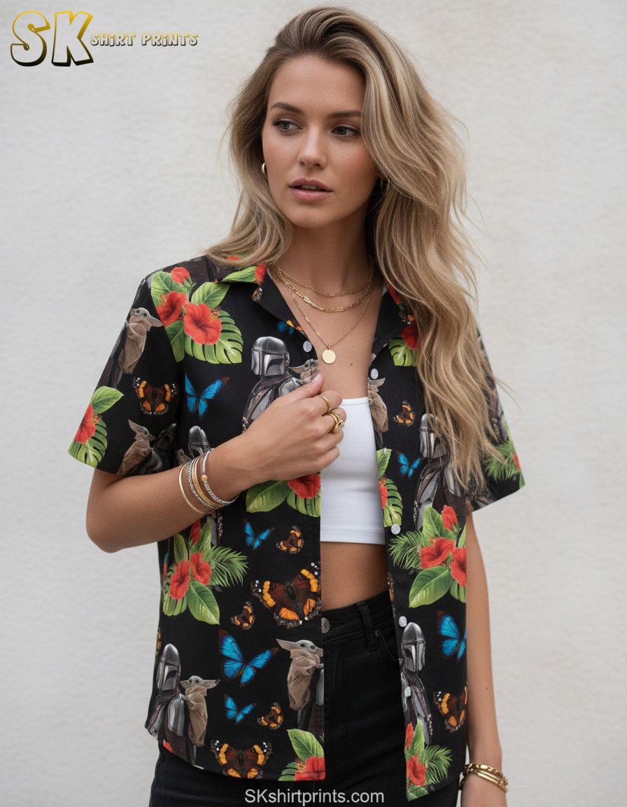 Star Wars R2D2 Hawaiian shirt showing helmeted characters, small creature with large ears, red hibiscus blooms, green leaves, and blue and orange butterflies in an all-over print