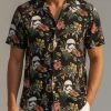 Star Wars Hawaiian shirts with an all-over print of hibiscus blooms, droids, helmets, and spacecraft on a tropical background