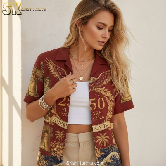 USA 250th Hawaiian shirt showing the Statue of Liberty, bald eagle, Liberty Bell, stars, and wave motifs with palm trees and florals in red, gold, and blue