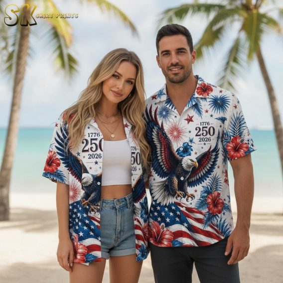 USA 250th Hawaiian shirt showing a bald eagle with wings spread, red white and blue fireworks, hibiscus flowers, and American flag stars and stripes