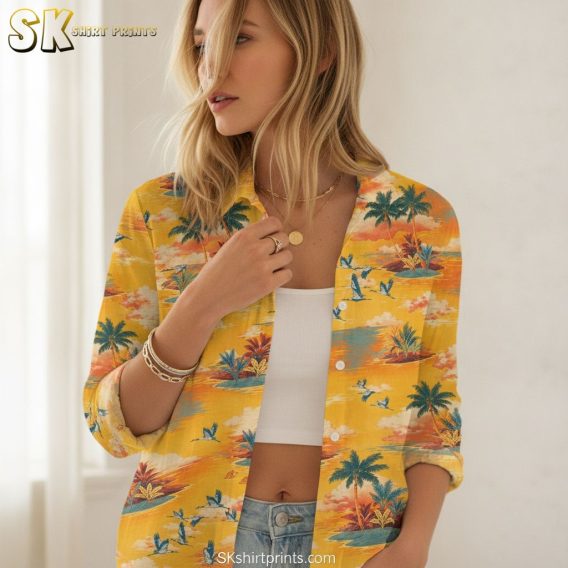 Yellow and blue Hawaiian shirt featuring ocean waves and blue water elements against yellow background