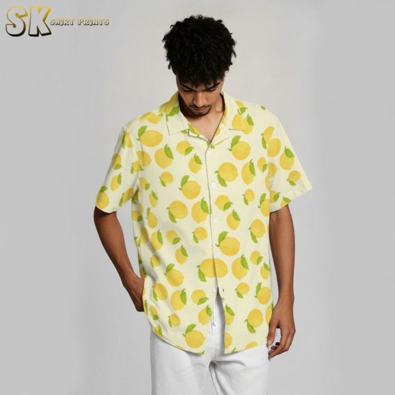 Yellow hawaiian shirt with decorative lemon and leaf citrus pattern
