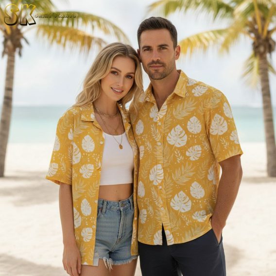 Yellow Hawaiian shirt for men printed with white monstera leaves and tropical fern motifs across a bright yellow background