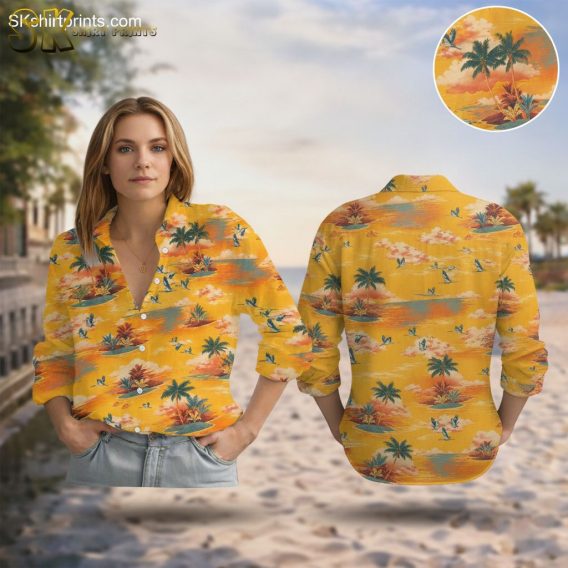 Yellow Hawaiian shirt featuring tropical island pattern with palm trees, birds, and ocean waves