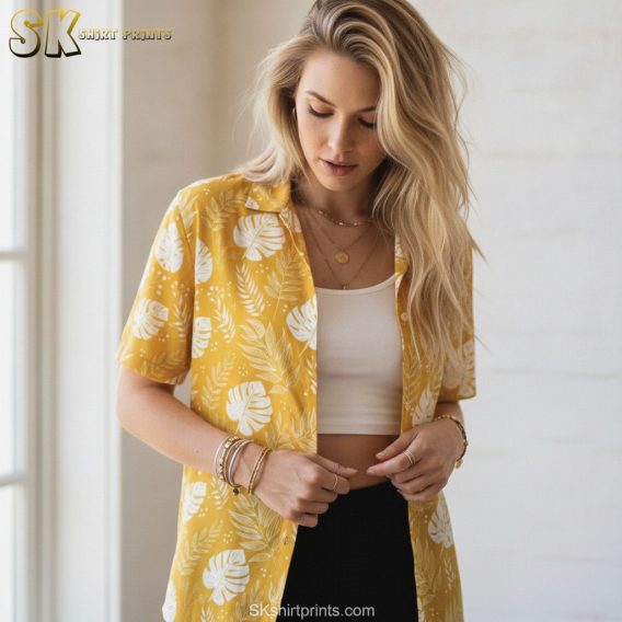 Yellow Hawaiian shirts for men shown with white monstera leaf and fern foliage all-over print on a bright yellow shirt
