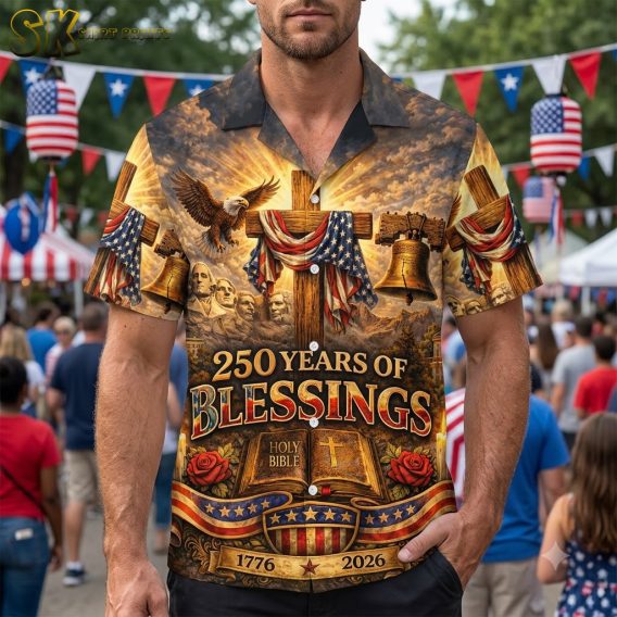 Male model wearing 250 years of America Hawaiian shirt with cross, American flag, eagle, Liberty Bell, and '1776-2026' anniversary print on studio background