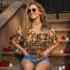 Female model wearing America 250 apparel Hawaiian shirt featuring cross with American flag, eagle, Liberty Bell, Holy Bible, and '250 Years of Blessings 1776-2026' commemorative print