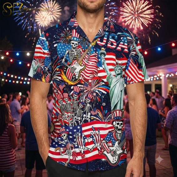 Male model wearing America 250th anniversary Hawaiian shirt with Uncle Sam skeleton, fireworks, American flags, and Statue of Liberty all-over print against a dynamic studio background