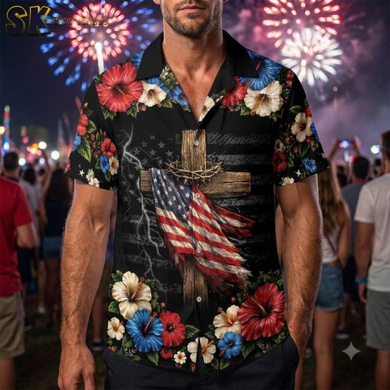 Man wearing america 250th anniversary Hawaiian shirt in studio setting, black shirt with American flag-wrapped cross and red white and blue hibiscus flower pattern